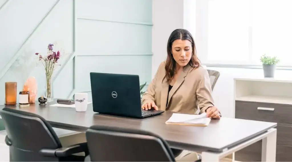 Bilingual legal assistant reviewing and organizing legal documents in a nearshore setup
