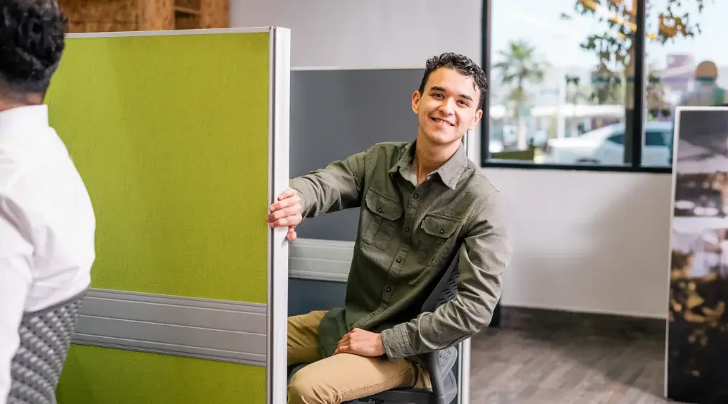 Bilingual customer service agents collaborating in nearshore office – Intugo